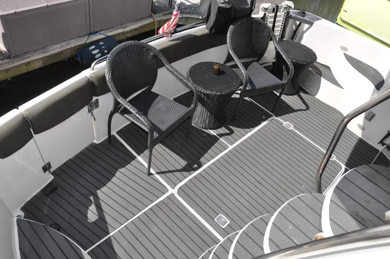 Slide: The Image of 2000 Carver 530 Voyager Pilothouse deck with wicker chairs and table. - 10