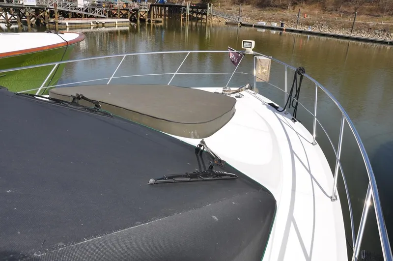 Slide: The Image of 2000 Carver 530 Voyager Pilothouse yacht docked at a marina. - 11