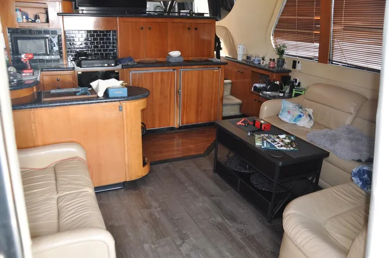 Slide: The Image of Interior of 2000 Carver 530 Voyager Pilothouse with cozy seating and modern kitchen. - 16