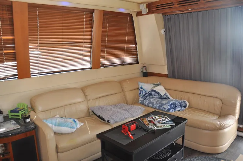 Slide: The Image of Luxurious interior of 2000 Carver 530 Voyager Pilothouse with leather seating and wooden blinds. - 17