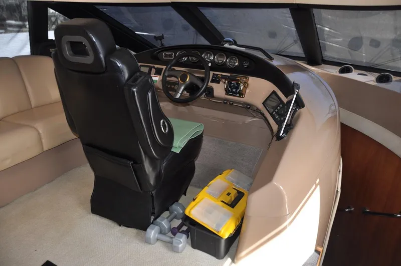 Slide: The Image of Interior of 2000 Carver 530 Voyager Pilothouse with helm and seating area. - 22