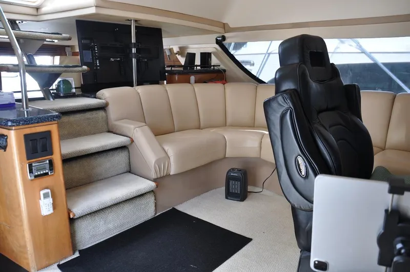 Slide: The Image of Interior of 2000 Carver 530 Voyager Pilothouse with leather seating and modern amenities. - 24