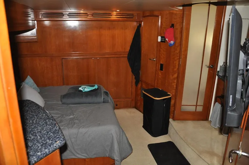 Slide: The Image of Luxurious cabin interior of 2000 Carver 530 Voyager Pilothouse yacht with wood paneling. - 26