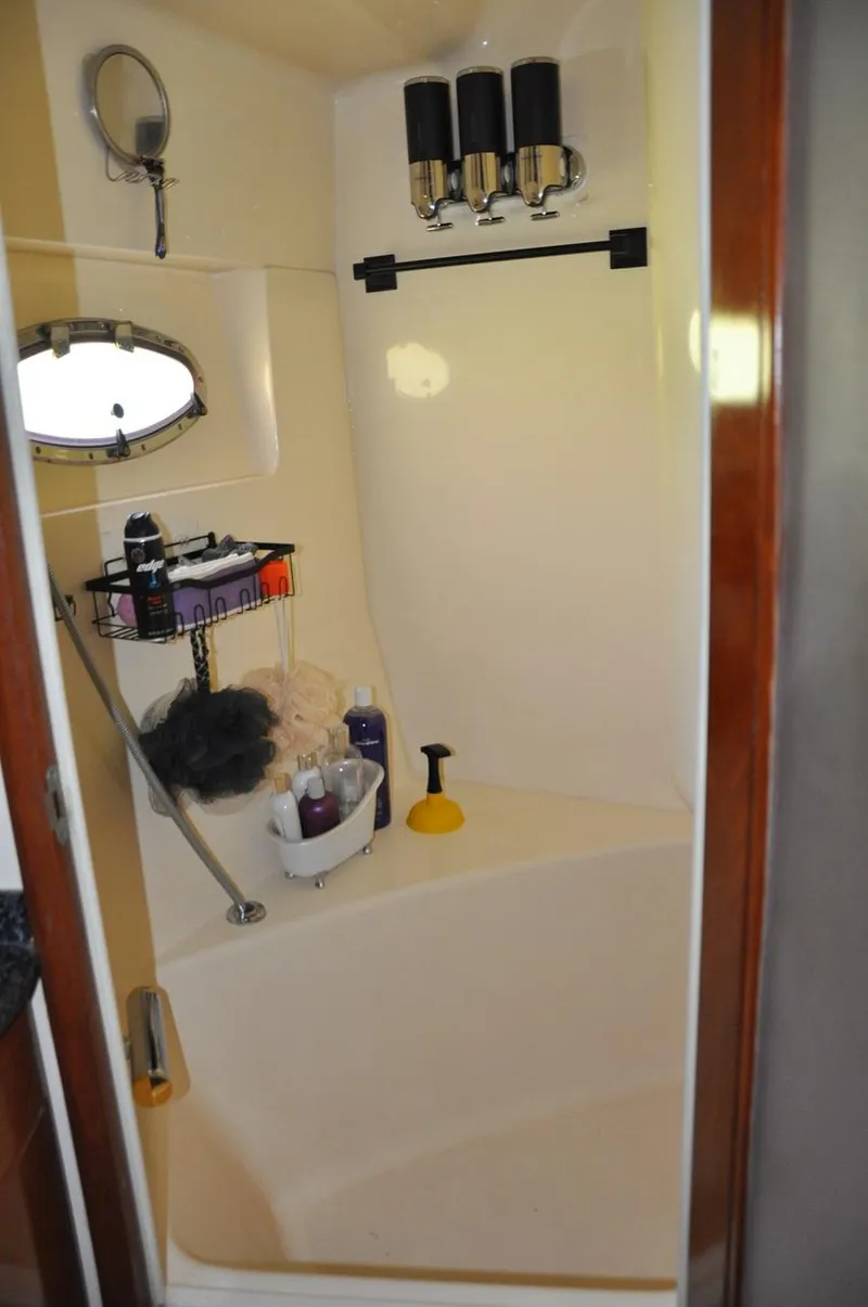 Slide: The Image of Bathroom in 2000 Carver 530 Voyager Pilothouse yacht with shower and toiletries. - 30
