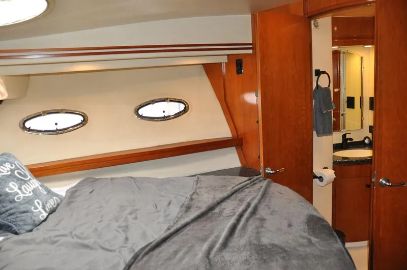 Slide: The Image of Interior of 2000 Carver 530 Voyager Pilothouse with cozy bedroom and ensuite bathroom. - 33
