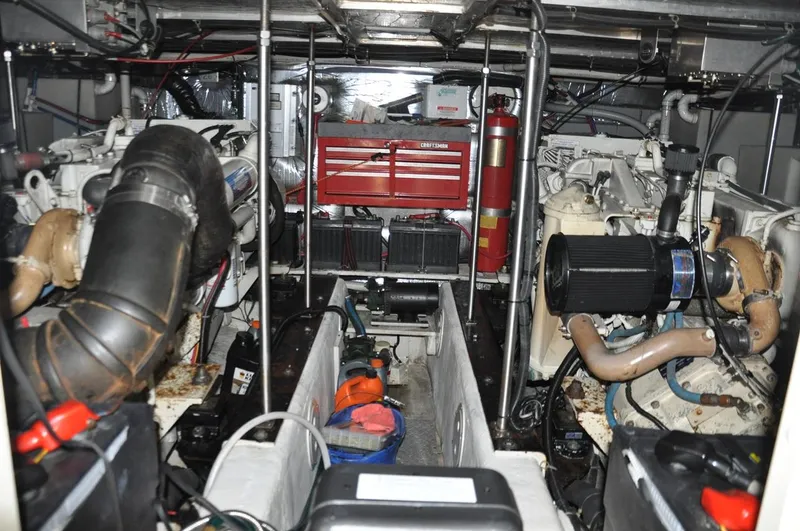 Slide: The Image of Engine room of 2000 Carver 530 Voyager Pilothouse with visible machinery and tools. - 35