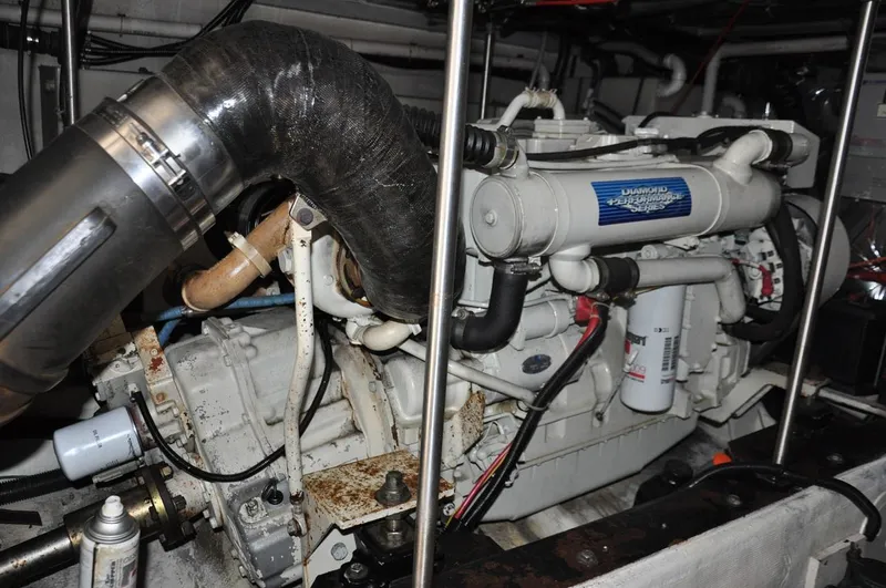 Slide: The Image of Engine room of 2000 Carver 530 Voyager Pilothouse with visible machinery and components. - 37