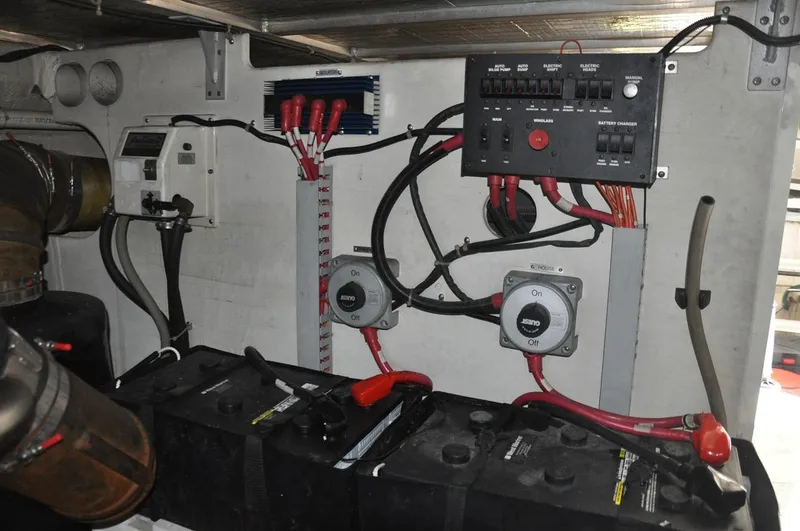 Slide: The Image of Electrical system of a 2000 Carver 530 Voyager Pilothouse, featuring batteries and control panel. - 42