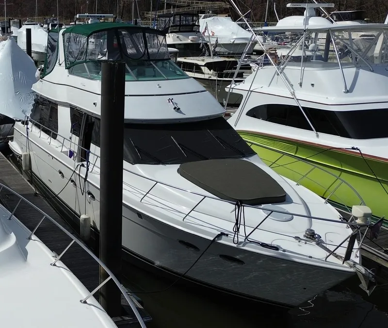 Slide: The Image of 2000 Carver 530 Voyager Pilothouse yacht docked at marina. - 6