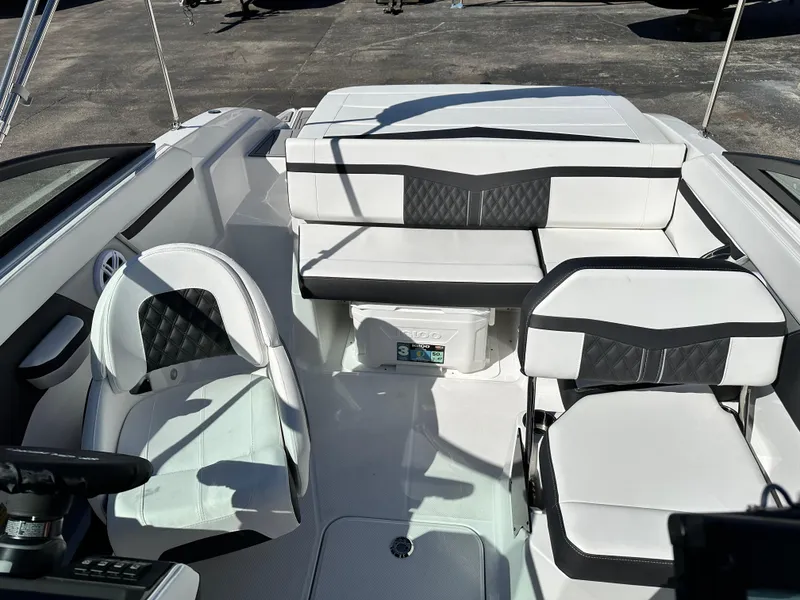 Slide: The Image of 2025 Monterey M20 boat interior with white and black seating, modern design. - 10