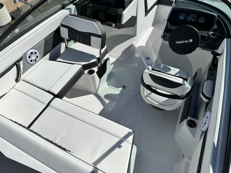 Slide: The Image of 2025 Monterey M20 boat interior with modern seating and sleek dashboard design. - 5