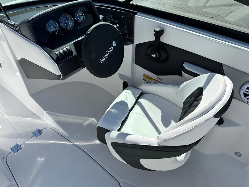 Slide: The Image of Cockpit of 2025 Monterey M20 boat with steering wheel and cushioned seat. - 7