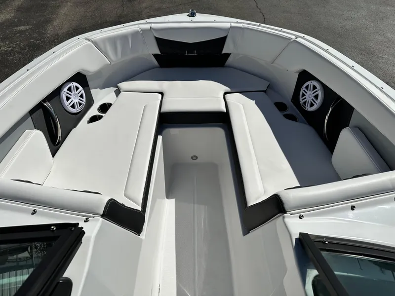 Slide: The Image of 2025 Monterey M20 boat interior with white seating and built-in speakers. - 9