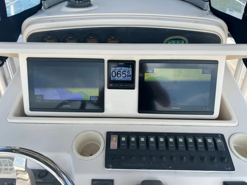 Slide: The Image of Control panel of 2005 Grady-White 283 RELEASE boat with navigation screens and gauges. - 10