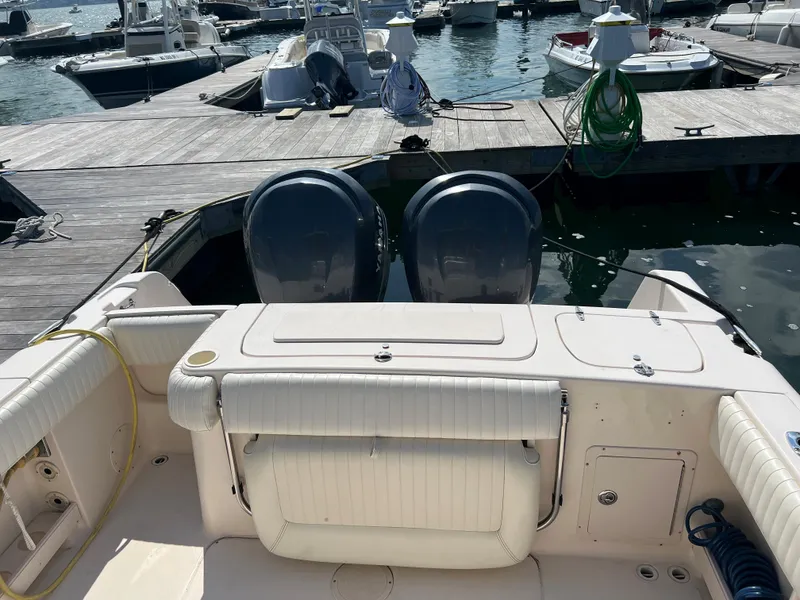 Slide: The Image of 2005 Grady-White 283 RELEASE boat docked with dual engines, marina background. - 5