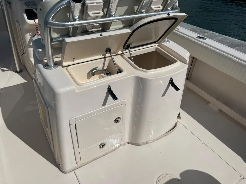 Slide: The Image of 2005 Grady-White 283 RELEASE boat sink and storage area. - 8