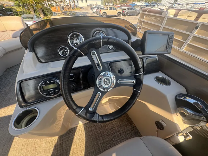 Slide: The Image of 2019 Misty Harbor 2285 Biscayne Bay CE boat dashboard with steering wheel and gauges. - 6
