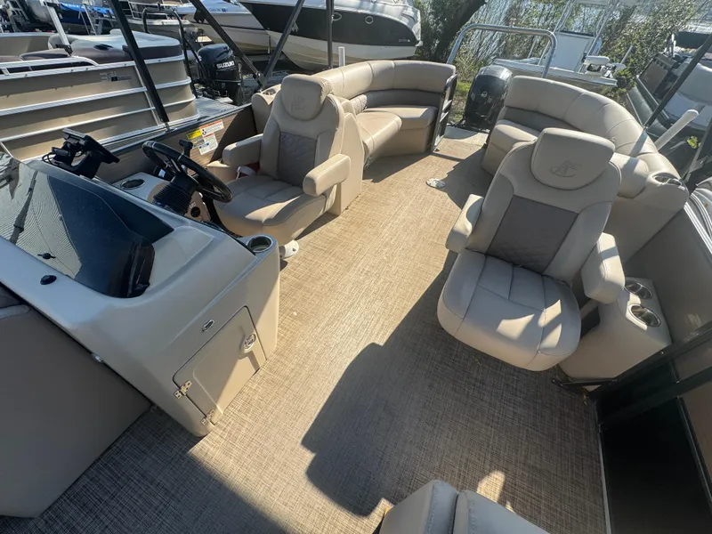 Slide: The Image of 2019 Misty Harbor 2285 Biscayne Bay CE pontoon boat interior with beige seating and helm. - 8