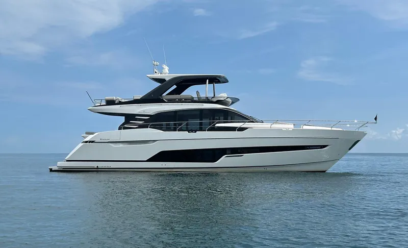 The Image of 2024 Fairline Squadron 68 yacht on calm sea under clear sky. - 1
