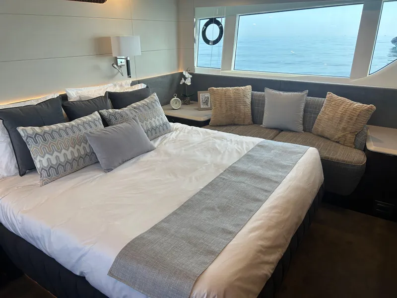 Slide: The Image of Luxurious bedroom interior of 2024 Fairline Squadron 68 yacht with ocean view. - 11