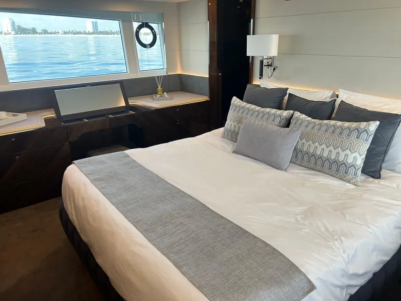 Slide: The Image of Luxurious bedroom interior of 2024 Fairline Squadron 68 yacht with ocean view. - 12