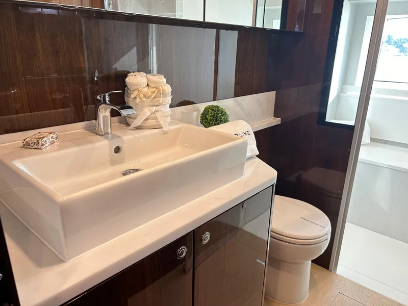 Slide: The Image of Luxurious bathroom in 2024 Fairline Squadron 68 yacht with modern sink and toilet. - 14