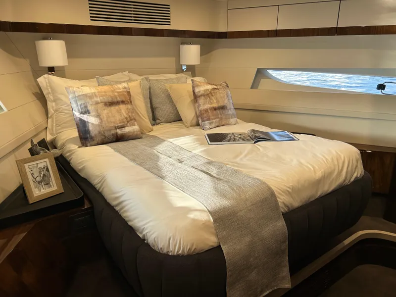 Slide: The Image of Luxurious bedroom interior of 2024 Fairline Squadron 68 yacht with elegant bedding and decor. - 16