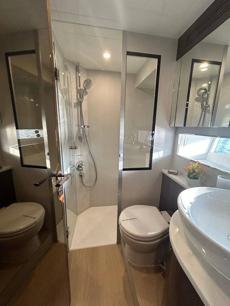 Slide: The Image of Luxurious bathroom in 2024 Fairline Squadron 68 yacht with modern fixtures and elegant design. - 17