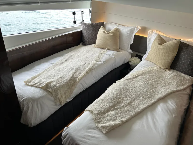 Slide: The Image of Twin beds in the luxurious 2024 Fairline Squadron 68 yacht cabin. - 18