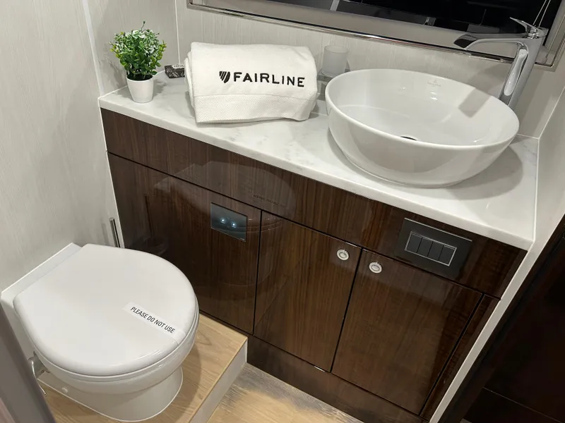 Slide: The Image of Luxury bathroom in 2024 Fairline Squadron 68 yacht with modern sink and toilet. - 19