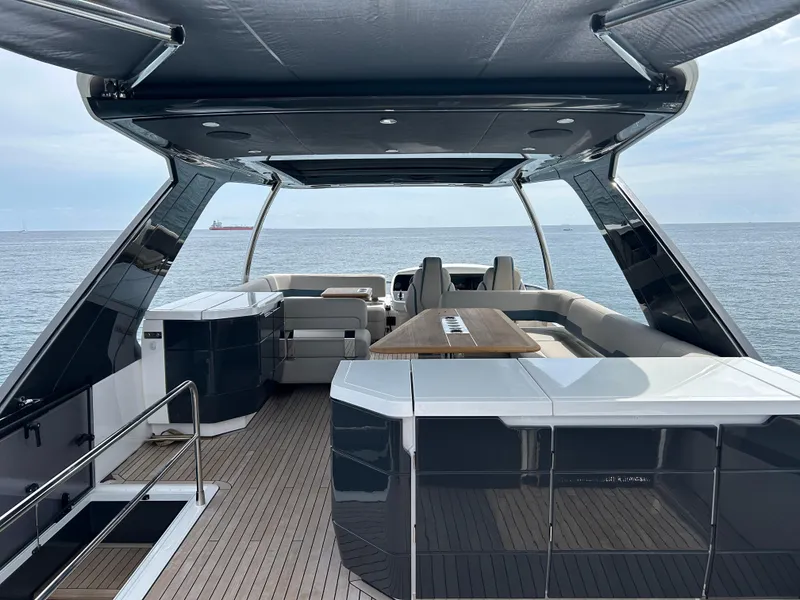 Slide: The Image of 2024 Fairline Squadron 68 yacht deck with modern seating and ocean view. - 20