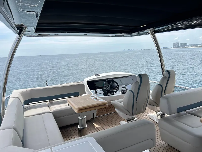 Slide: The Image of Luxurious 2024 Fairline Squadron 68 yacht interior with ocean view and elegant seating. - 21