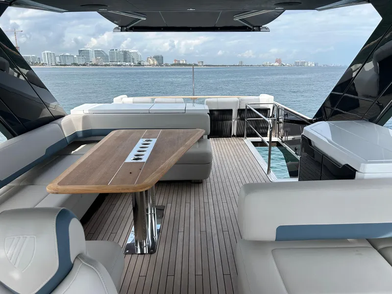 Slide: The Image of Luxury 2024 Fairline Squadron 68 yacht deck with elegant seating and ocean view. - 24