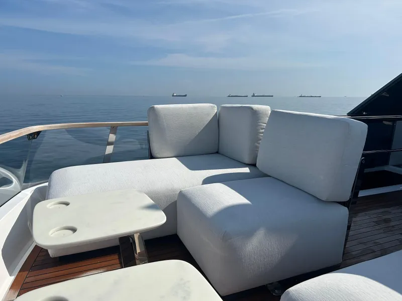 Slide: The Image of Luxurious 2024 Fairline Squadron 68 yacht deck with plush seating and ocean view. - 26