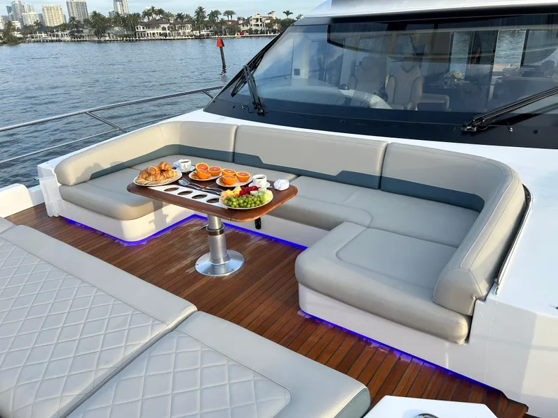 Slide: The Image of Luxurious 2024 Fairline Squadron 68 yacht deck with elegant seating and breakfast setup. - 30