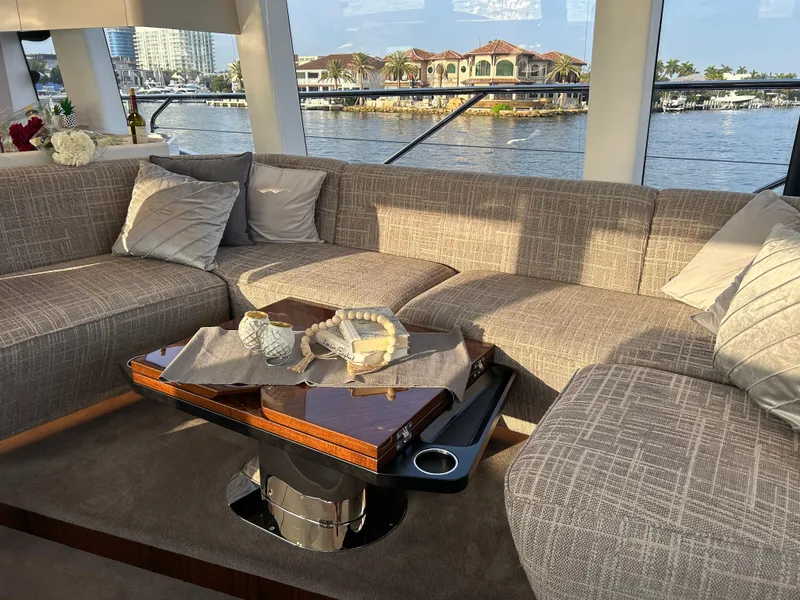 Slide: The Image of Luxurious interior of 2024 Fairline Squadron 68 yacht with elegant seating and waterfront view. - 5