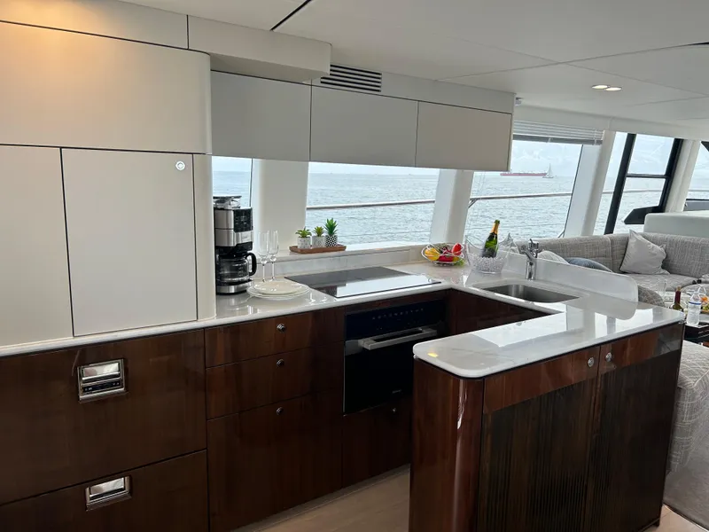 Slide: The Image of Luxurious kitchen interior of 2024 Fairline Squadron 68 yacht with ocean view. - 8