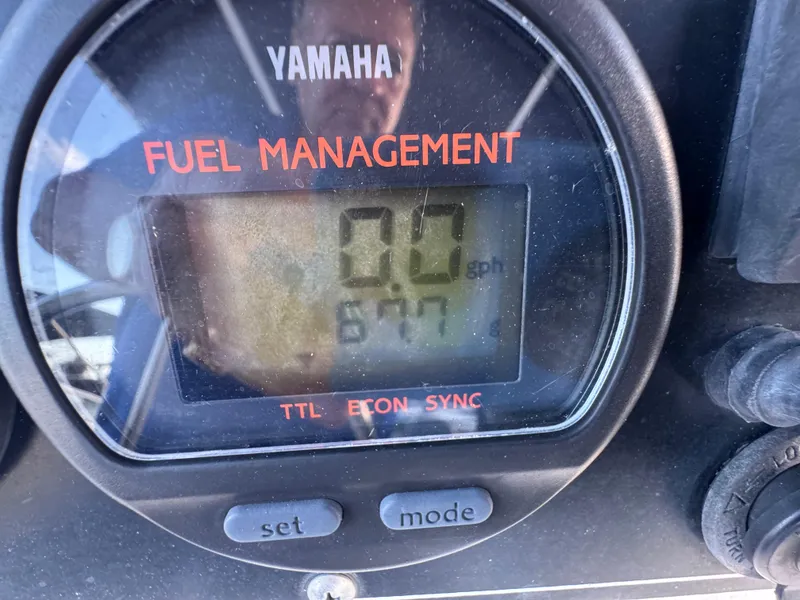 Slide: The Image of Yamaha fuel management display on 2000 Boston Whaler 26 Outrage boat dashboard. - 11