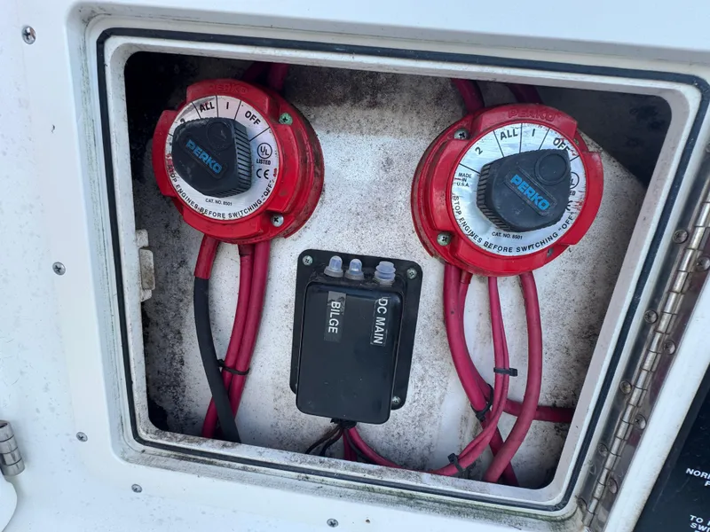Slide: The Image of Electrical panel of a 2000 Boston Whaler 26 Outrage boat with red wiring. - 17