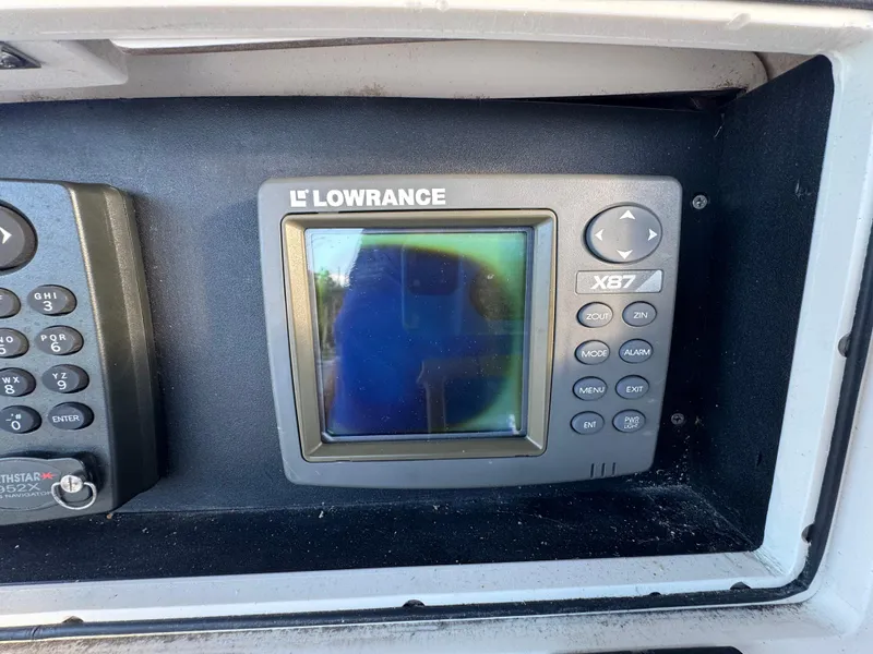 Slide: The Image of Lowrance X87 fishfinder on a 2000 Boston Whaler 26 Outrage boat dashboard. - 19