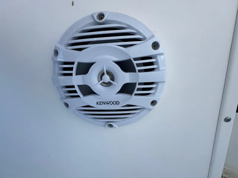 Slide: The Image of Kenwood speaker on 2000 Boston Whaler 26 Outrage boat, white grille design. - 23