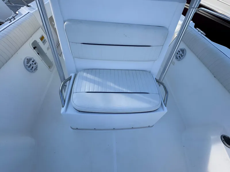 Slide: The Image of Boston Whaler 26 Outrage 2000 boat interior with white cushioned seating. - 26