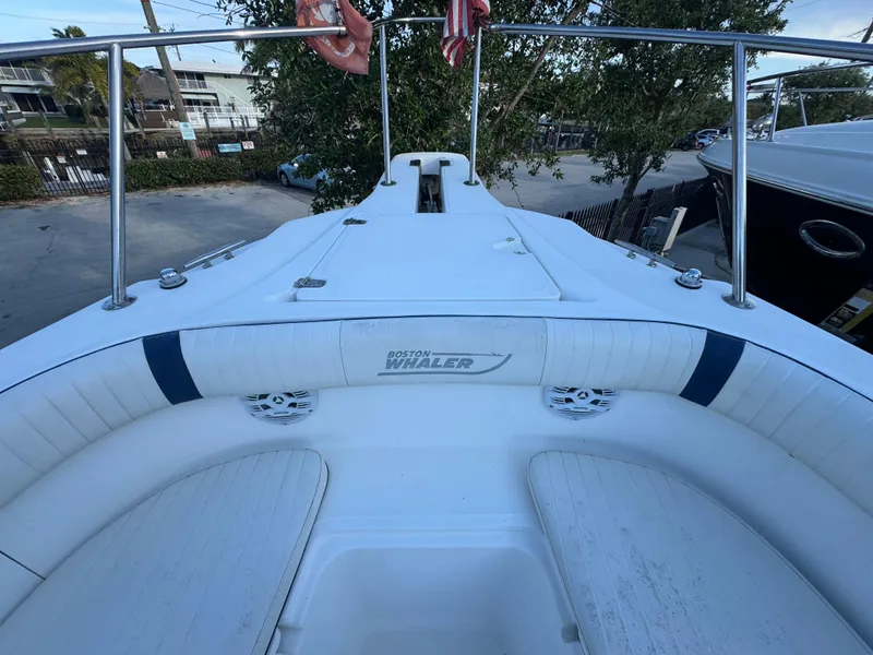 Slide: The Image of Boston Whaler 26 Outrage 2000 model boat deck with seating and railing. - 35
