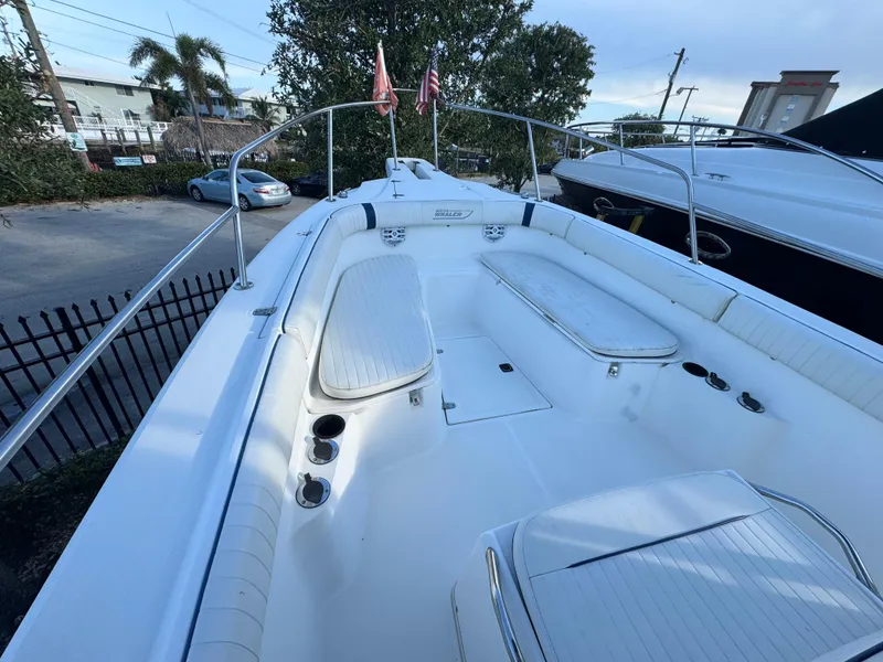 Slide: The Image of 2000 Boston Whaler 26 Outrage boat with spacious seating and sleek design. - 38