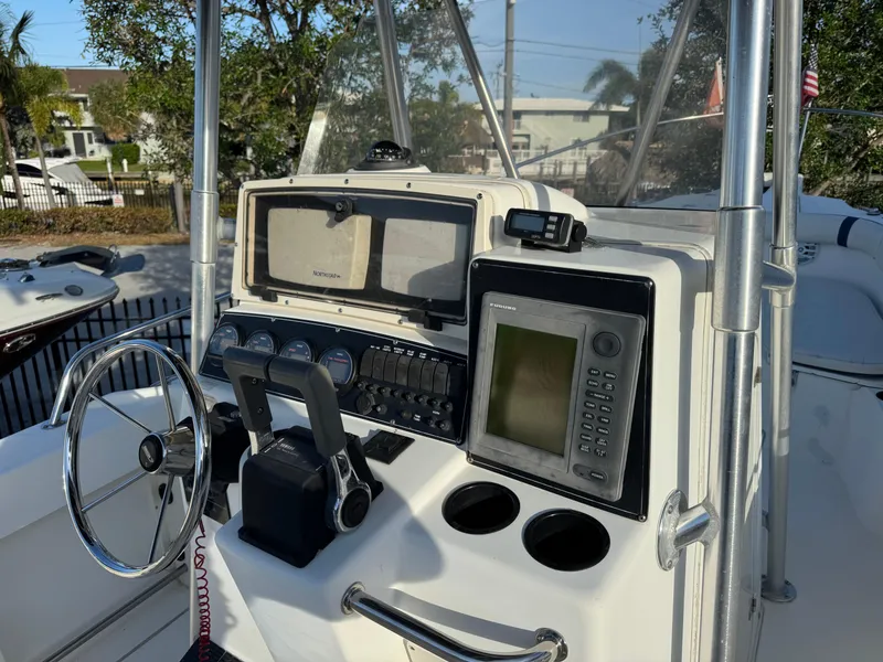 Slide: The Image of Control panel of a 2000 Boston Whaler 26 Outrage boat with navigation equipment. - 7