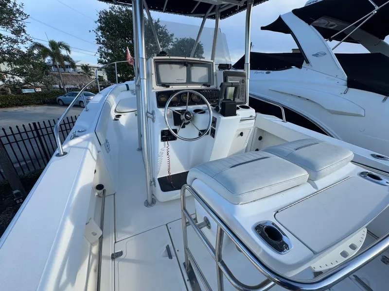Slide: The Image of 2000 Boston Whaler 26 Outrage boat interior with steering console and seating. - 8