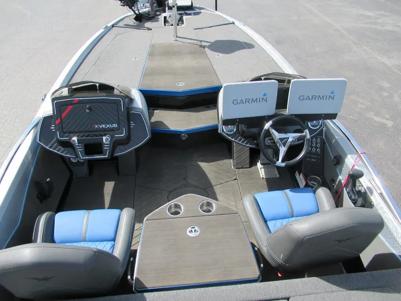 Slide: The Image of 2021 Vexus VX20 boat interior with Garmin displays and blue-accented seating. - 6