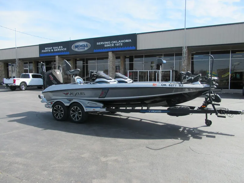 Slide: The Image of 2021 Vexus VX20 boat on trailer outside Nichols Marine dealership. - 8