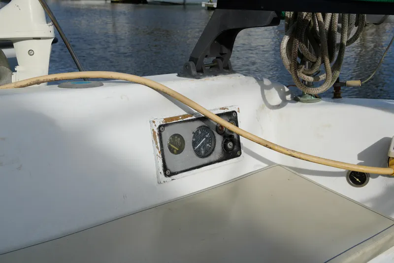 Slide: The Image of 1974 Morgan 33 Out Island sailboat cockpit with gauges and ropes. - 12