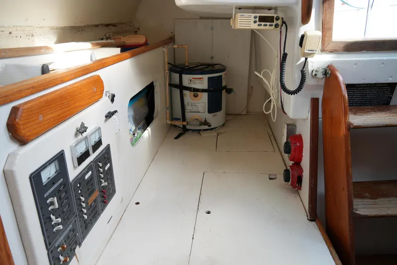 Slide: The Image of 1974 Morgan 33 Out Island interior with control panels and equipment. - 25